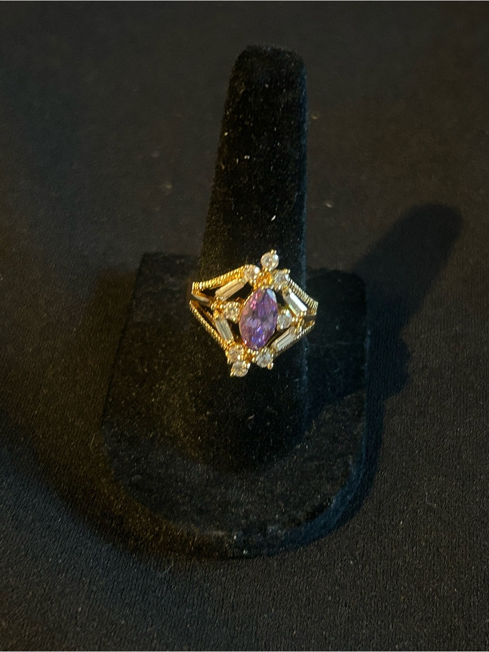 Gold Tone Ring with Purple Marquise Stone and Clear Accents